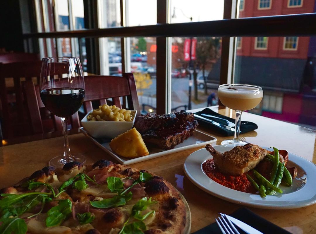 Irresistible image of two mouthwatering dishes from The Grizzly Grill – a freshly baked woodfire pizza and succulent, perfectly grilled ribs. Make your reservations now at Kingston's favorite dining spot. Reserve your table for a delightful culinary experience in Kingston, Ontario!