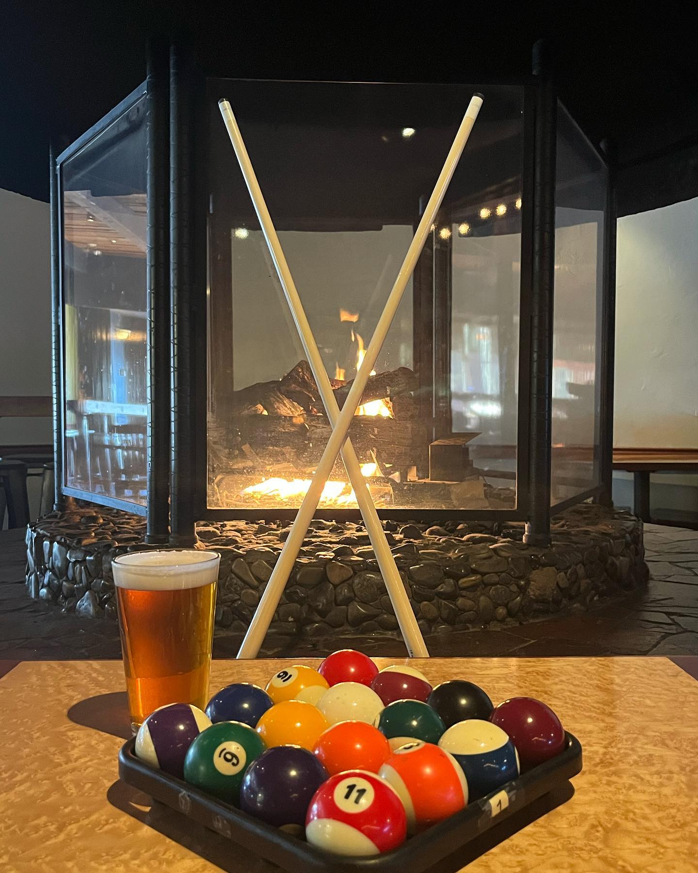 Vibrant image showcasing neatly racked pool balls at The Grizzly Grill, the ultimate destination for bar, grill, and billiards enthusiasts in Kingston. Enjoy a game of pool while savoring delicious food and drinks at our iconic establishment!